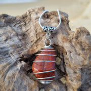 'Anadara' Polished Beach Stone Caged Pendants